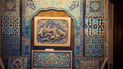 Wall Mural - The engraved blue pattern on the wall