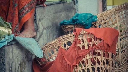 Wall Mural - Woven baskets with red silk tiedd on it