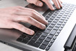 © Ivan - Close-up of typing on laptop keyboard of male hands