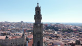 Fototapeta Miasto - Aerial view of the Clerigos Tower (Torre dos Clerigos), one of the landmarks and symbols of the city of Porto, Portugal. Unesco World Heritage Site.