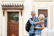 © Marko Rupena - Happy senior couple of tourists in a city