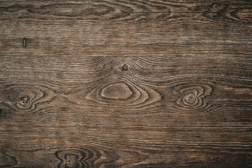 Light brown wood texture with jagged circles and curved lines. Background with natural wood pattern for text, image or product. Beautiful drawing on the surface of the board