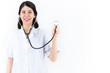 © eda - Young female doctor and stethoscope isolated in white background. heart health and medical concept.