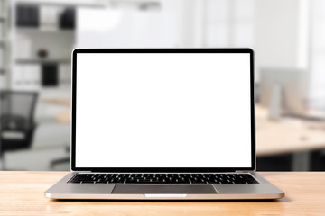 laptop blank screen on wood table with modern workplace office room background, mockup, template for
