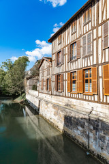 Wall Mural - Window shutters  of traditional  half timbered frame house in France