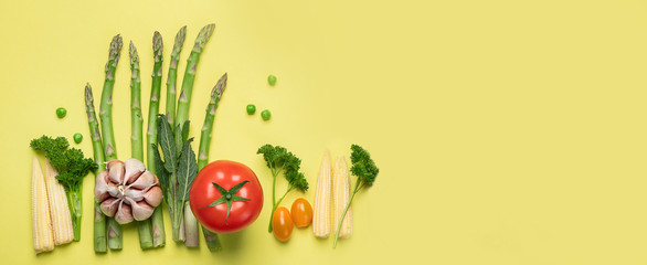 Wall Mural - Fresh fruits and vegetables on yellow background