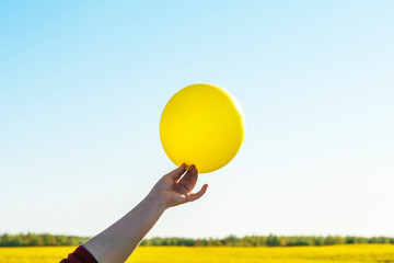 yellow balloon in blue sky . sign of emotion. image for background, wallpaper. copy space