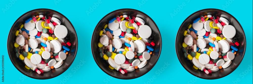 Banner three bowls of Medical capsules. pharmaceutical medicine pills, tablets and capsules on a wooden bowl, top view - obrazy, fototapety, plakaty 