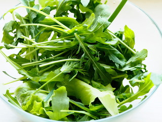 Wall Mural - fresh salad greens in a clear Cup