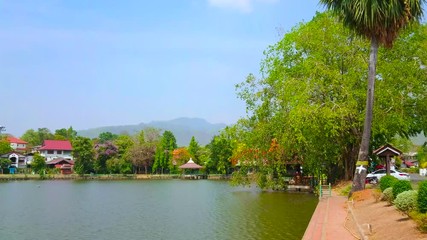 Sticker - The embankment of Nong Kham lake is perfect place for the day walk and relax in shade of lush trees, Mae Hong Son, Thailand