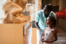 Man And His Daughter Visiting Art Museum