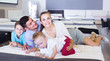 © JackF - parents with two young sons testing mattress in store