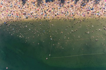  Holiday vacation on the sandy beach, sunbathing and swimming in the water