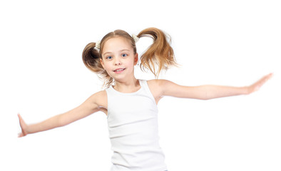 Wall Mural - Young cute smiling girl with grey blue eyes and two hair tails jumps isolated on white background