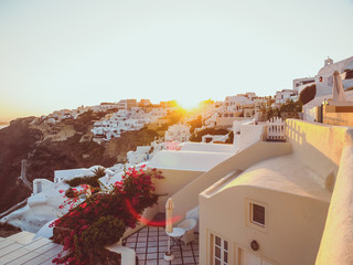 Santorini Sunset. Traditional white cave house on Santorini island . Santorini, Cyclades, Greece. Amazing sunset view