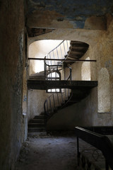 Wall Mural - Spiral staircase in abandoned building