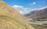 Fototapeta Natura - A river flowing through a high Himalayan mountain landscape in the Spiti Valley