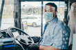 bus driver with mask wearing protecting gloves on his hand to protect himself