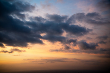 Colorful dawn / dusk sky with dark clouds