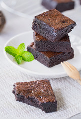 Wall Mural - homemade chocolate brownies on white plate.