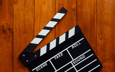 clapperboard on wooden background