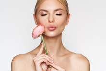 Image Of Alluring Shirtless Woman Holding Flower And Making Kiss Lips