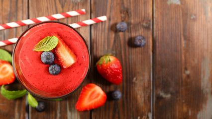 Wall Mural - strawberry and blueberry smoothie on white background