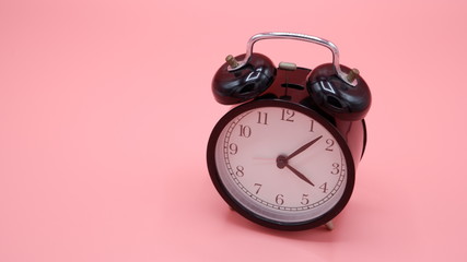 alarm clock on pink background