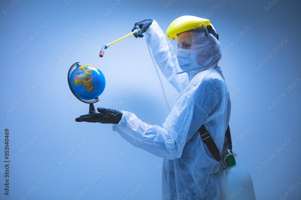 Scientist spraying Earth globe to decontaminate planet from viruses and germs. - obrazy, fototapety, plakaty 