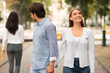 Boyfriend Looking At Other Woman Walking With Girlfriend In Park
