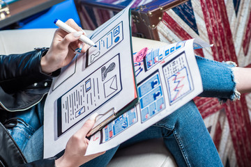 Wall Mural - application mockups on paper close up. designer draws a template for the future site. concept - work