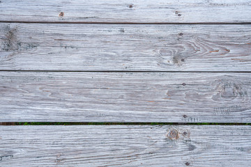 close up of the weather planks of a boardwalk. useful as wooden background