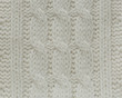 © Gregories - Knitted white texture with a pattern of braids