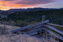 A Wooden Fence Overlooking A Radiant Sunrise In The New Mexico Rocky Mountains
