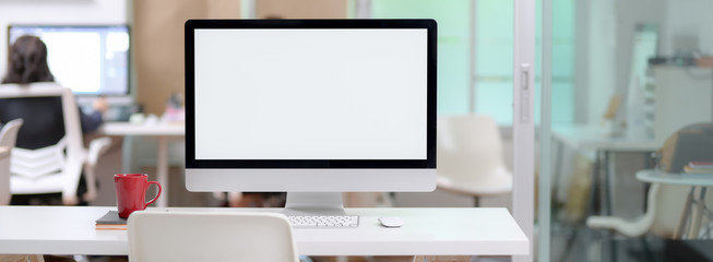 Canvas Print - close up view of office desk with blank screen computer and coffee mug