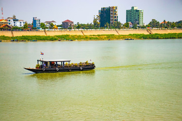 Wall Mural - A beautiful view of boat in Mekong river at Phnom Penh, Cambodia.