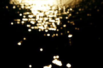 Wall Mural - yellow gold boken on black background