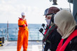 © ValStock - Seamen's on ship deck with safety equipments connect with vhf radio station.