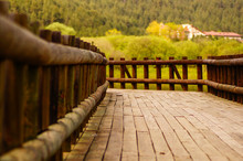 Wooden Bridge On The Meadow In Nature. Woods Of A Small Bridge In The Nature.