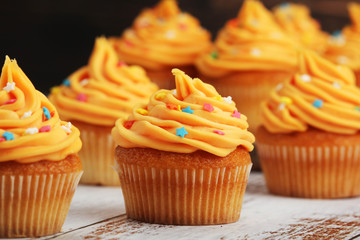 Cupcakes with orange icing on top