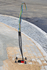 Two cables are prepared for connecting the lighting pole.