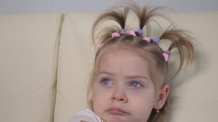 little girl a crying upset tears sitting on the couch. domestic violence concept lifestyle . unhappy