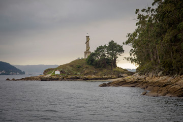 Views of the lighthouse of the Tambo island, from a boat, of the Ria de Pontevedra in Galicia, Spain, Europe.