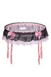 Detailed shot of a pink garter belt decorated with black ruffles and pink silk bows. The delicate lace lingerie with floral pattern is isolated on the white background.
