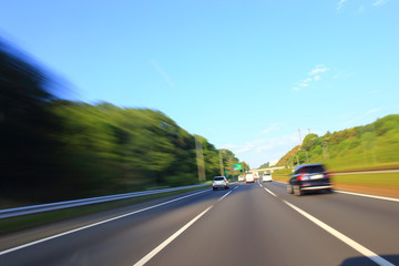 Speeding car on the highway, motion blur