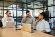© Drobot Dean - Smiling group of colleagues sitting in the hub