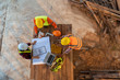 © visoot - Aerial view of group of Asian engineers or architect and construction worker at construction site.