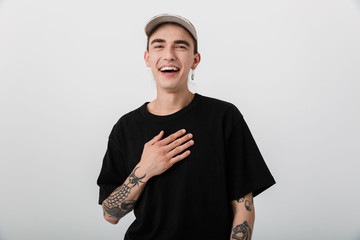 Portrait closeup of pleased happy man wearing black clothes looking at camera and laughing