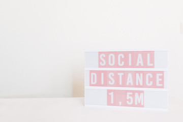 illuminated poster of social distance 1,5 meters on white background