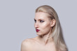 © Evgenia - A beautiful girl with light natural hair looks to the side. Bright make-up.